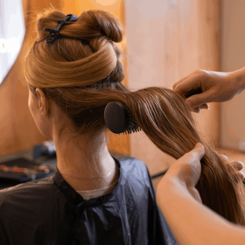 female-client-getting-her-hair-done-hairdresser